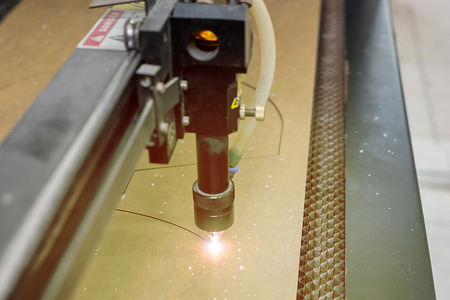 cutting machine carving patterns on the plastic plate. laser machine cutting pattern on acrylic...