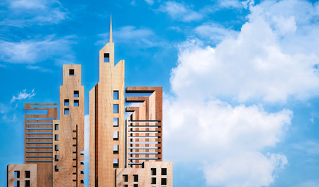 miniature building made from wood on blue sky background, eco buildings conceptの写真素材
