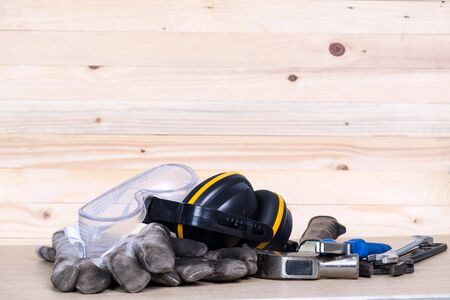 Standard construction safety and construction tools on wooden backgroundの写真素材