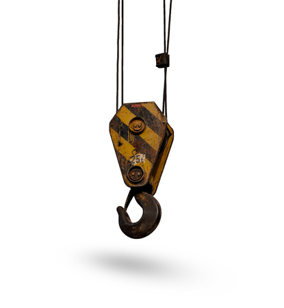 Old yellow lifting crane hook isolated on white background.の写真素材