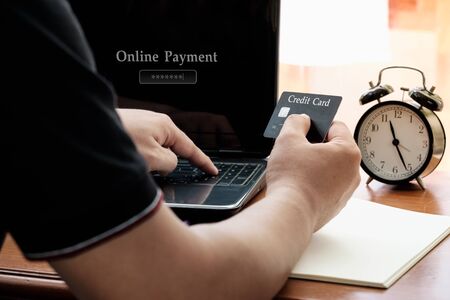 Close up hand holding credit card for online payment, online payment concept.の写真素材
