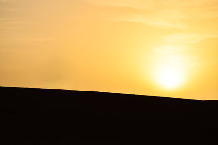 Sunrise Over the Sahara Desert in Moroccoの写真素材