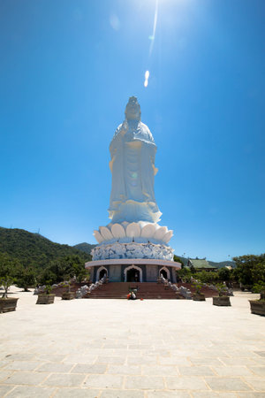 Statue of giant Guayin under the blue skyの写真素材