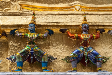 statue in grand palace round the golden pagoda of thailandの写真素材