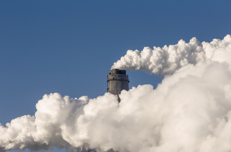Smoking chimney of industrial buildings complexの写真素材