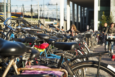Bicycles parked together in a parking areaの写真素材