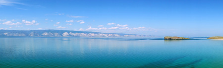 Delicate blue tone of Lake Baikal in calm weather. Beautiful summer morning. Siberia, Russia.の写真素材