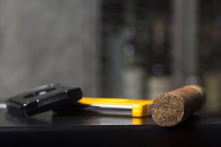 Cigar and cutters on black boxの写真素材