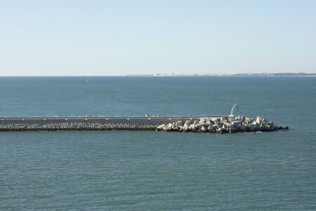 Breakwater at the entrance to the harbour at Cadiz Spainの写真素材