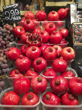 Red juicy Pomegranates for sale in a Spanish marketの写真素材