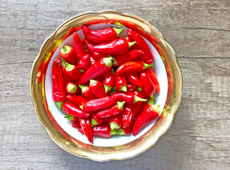 Dish of freshly picked red chilli peppersの写真素材
