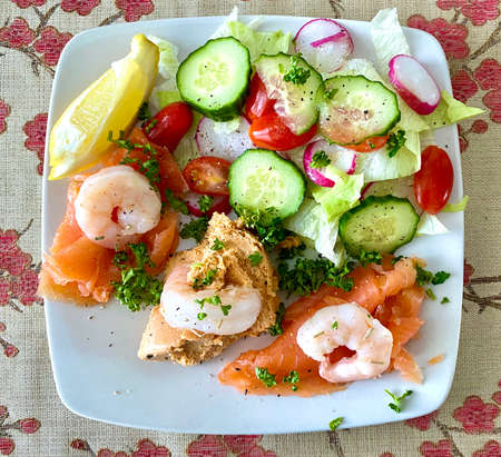 Delicious seafood salad platter with fresh crab, smoked salmon and prawnsの写真素材