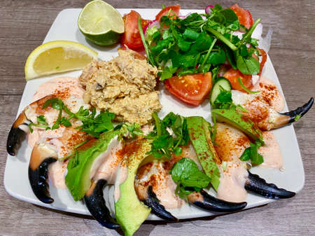 Luxury fresh seafood salad of crab claws, mixed crab meat, avocado and green saladの写真素材
