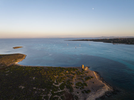 La Pelosa beach in Stintino in the northern part of Sardinia. Photos taken with a drone during the setting sun.の写真素材
