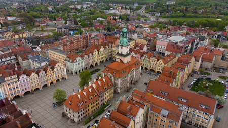 Drone shot reveals the charm of Jelenia GÃ³ra's market square, surrounded by quaint architecture,...