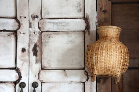 Wicker basket hanging on the wall in the room, stock photoの写真素材