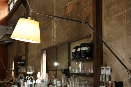 Coffee shop interior with a lamp in the foreground, nobodyの写真素材