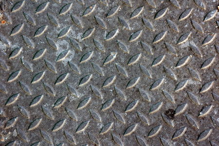 Metal sheet with rhombus pattern as background. Close up.の写真素材