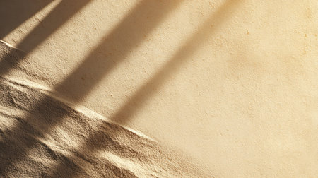 This image showcases a smooth, earthy wall with soft lighting and distinct shadows, creating a serene and minimalistic atmosphere perfect for backgrounds.の素材