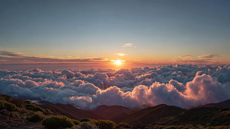 Experience the beauty of a breathtaking sunrise over a sea of clouds, illuminating a mountainous landscape with vibrant colors and soft hues, evoking tranquility.の素材