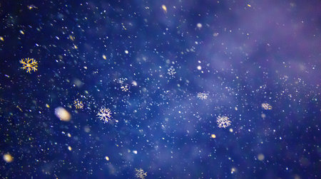 Beautiful illustration of snowflakes gently falling against a dark blue background, evoking a tranquil winter atmosphere perfect for seasonal themes.の素材