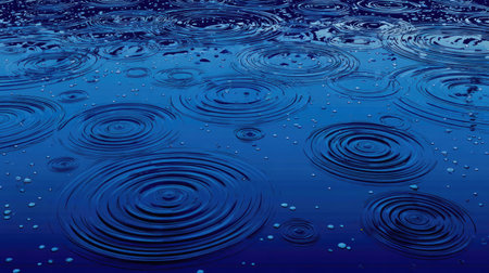 This image captures the serene beauty of raindrops falling on a deep blue water surface, creating mesmerizing circular ripples and reflections.の素材