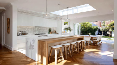 Bright and airy modern kitchen featuring a spacious wooden bar with stylish stools, large windows inviting natural light, and a seamless connection to the outdoor space.の素材