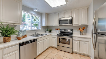 A fresh and appealing kitchen featuring sleek stainless steel appliances, abundant natural light, and stylish decor. Perfect for cooking and gatherings.の素材