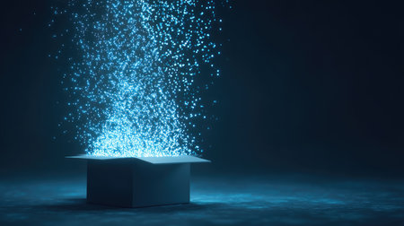 A captivating image of a box in a dark setting, emitting sparkling blue particles, creating a sense of mystery and magic. Perfect for tech and creative projects.の素材