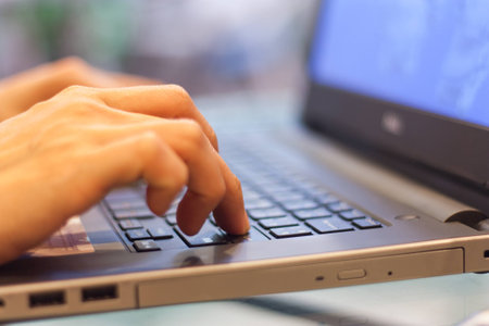 Office worker is working by typing on the keyboard.の写真素材