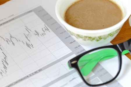 Coffee cup on office documentsの写真素材