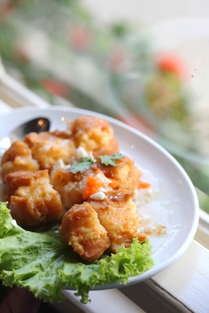 Chicken Fritter topped with sauceの写真素材