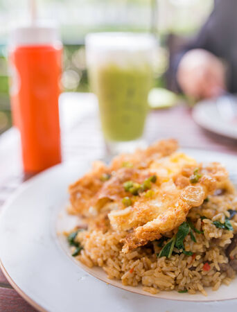 Basil Beef Fried Rice Topped with a fried eggの写真素材