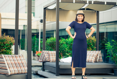 young pregnant woman ,charming smileの写真素材