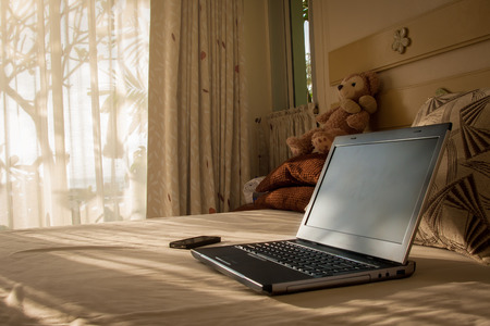 laptop on a bed, Technologyの写真素材