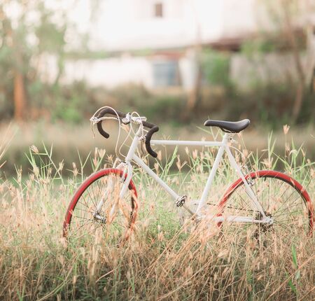 Beautiful landscape image with Bicycle at sunsetの写真素材