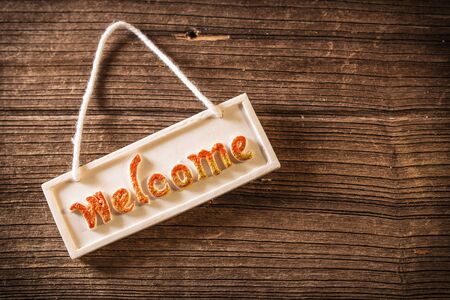 Welcome sign on wooden fenceの写真素材