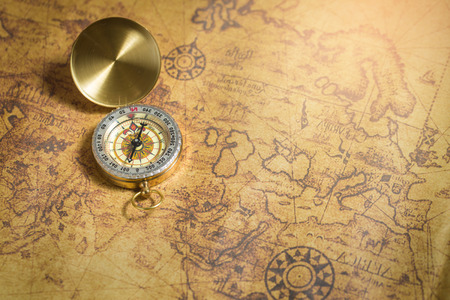 Old compass on vintage map.の写真素材
