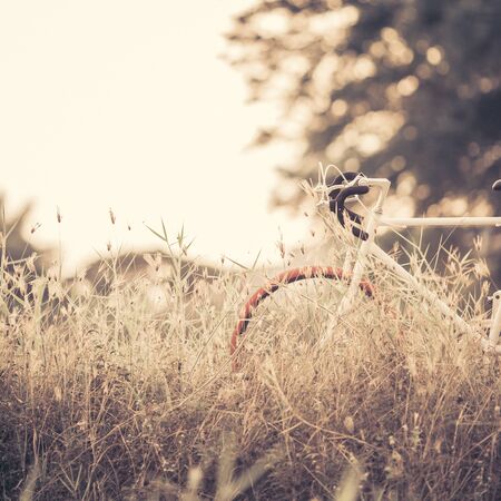 Beautiful landscape image with Bicycle at sunsetの写真素材