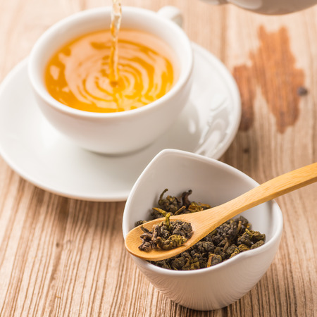 Closeup of cup of tea on vintage wooden backgroundの写真素材