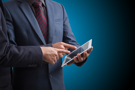 Businessmen using touchpad,,Investment conceptの写真素材