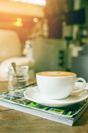 cup of coffee on table in coffee shop cafeの写真素材
