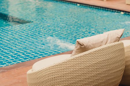 Relaxing Rattan Sofa At Swimming Pool,Vintage filterの写真素材