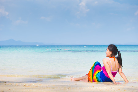 Happy young woman on the beachの写真素材