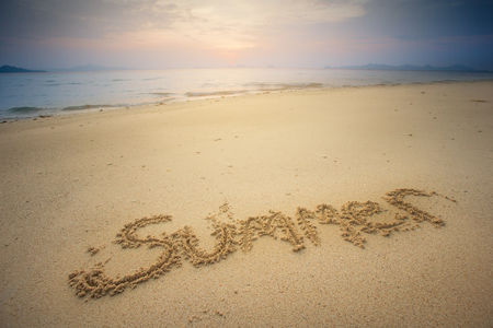 Inscription on wet sand Summer. Concept photo of summer vacation.の写真素材