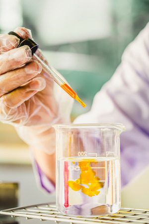 Hands of clinician holding tools during scientific experiment in laboratory,MERSの写真素材