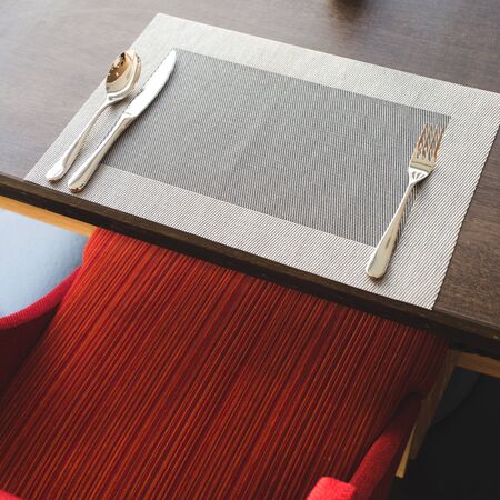 cutlery on the table in a restaurant table setting, knife, fork, spoon, interior