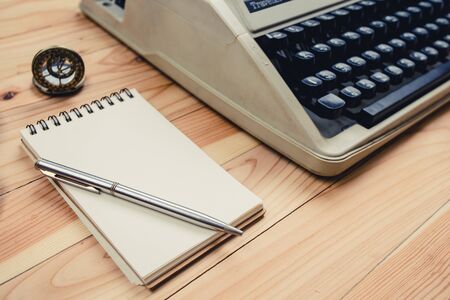 note book on wooden backgroundの写真素材