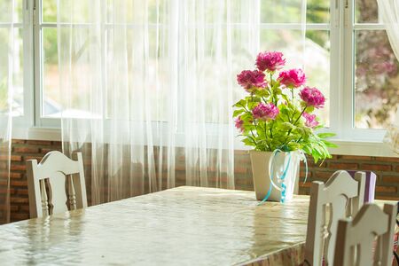 colorful flowers pots decoration on wooden tableの写真素材