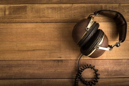Headphones on wooden backgroundの写真素材
